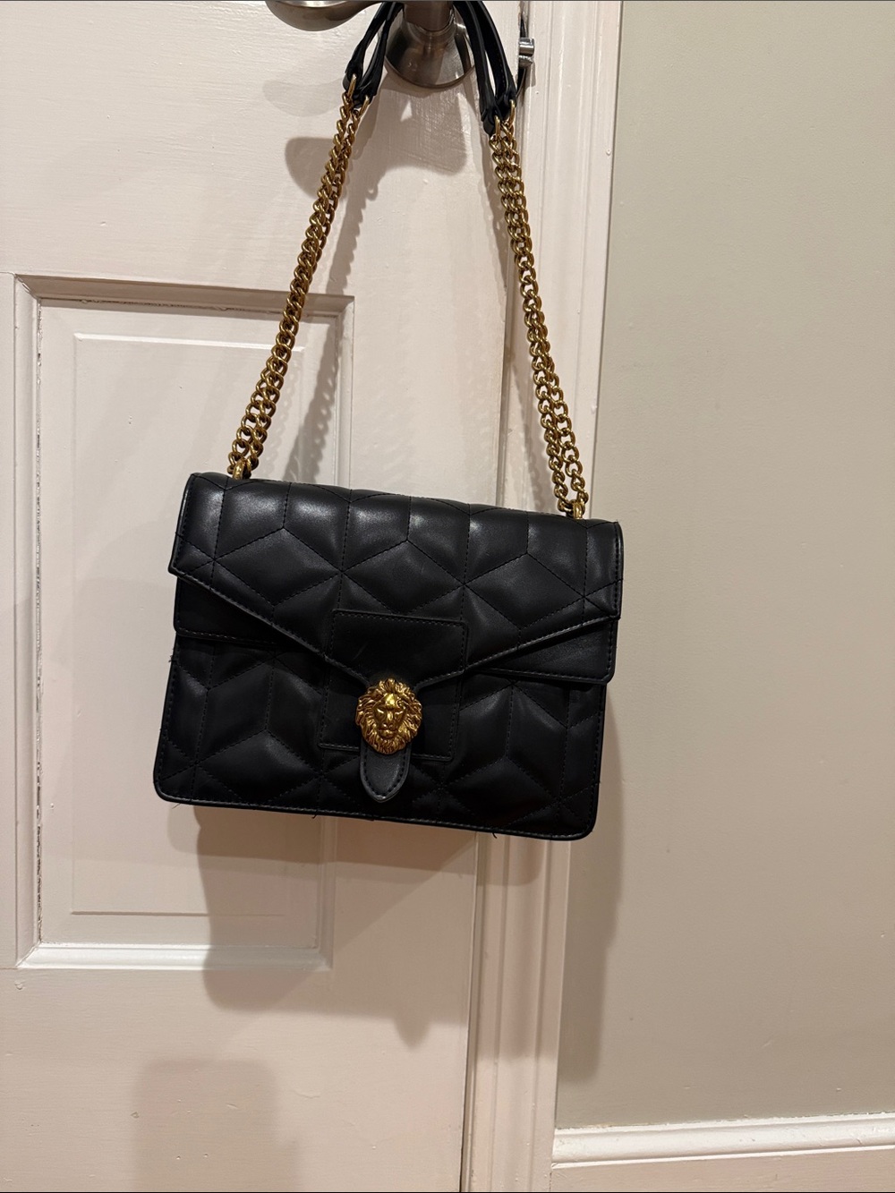 Anne Klein Black Quilted Shoulder Bag with Gold Chain and Lion Accent